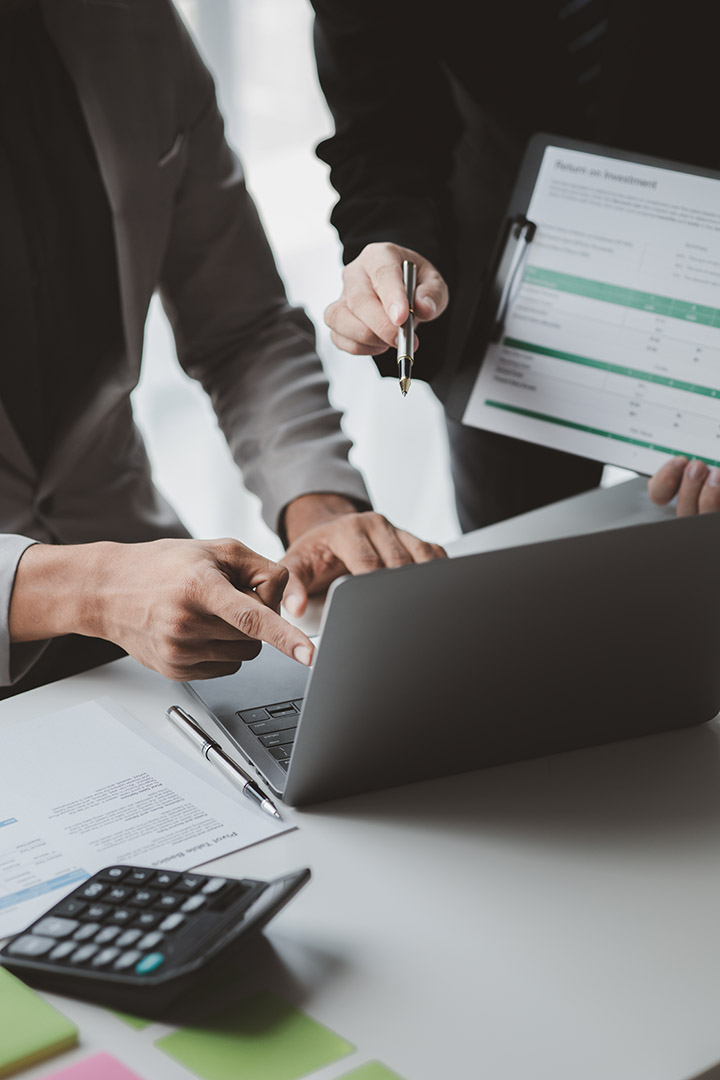 Two businessmen pointed to the material for the meeting, working